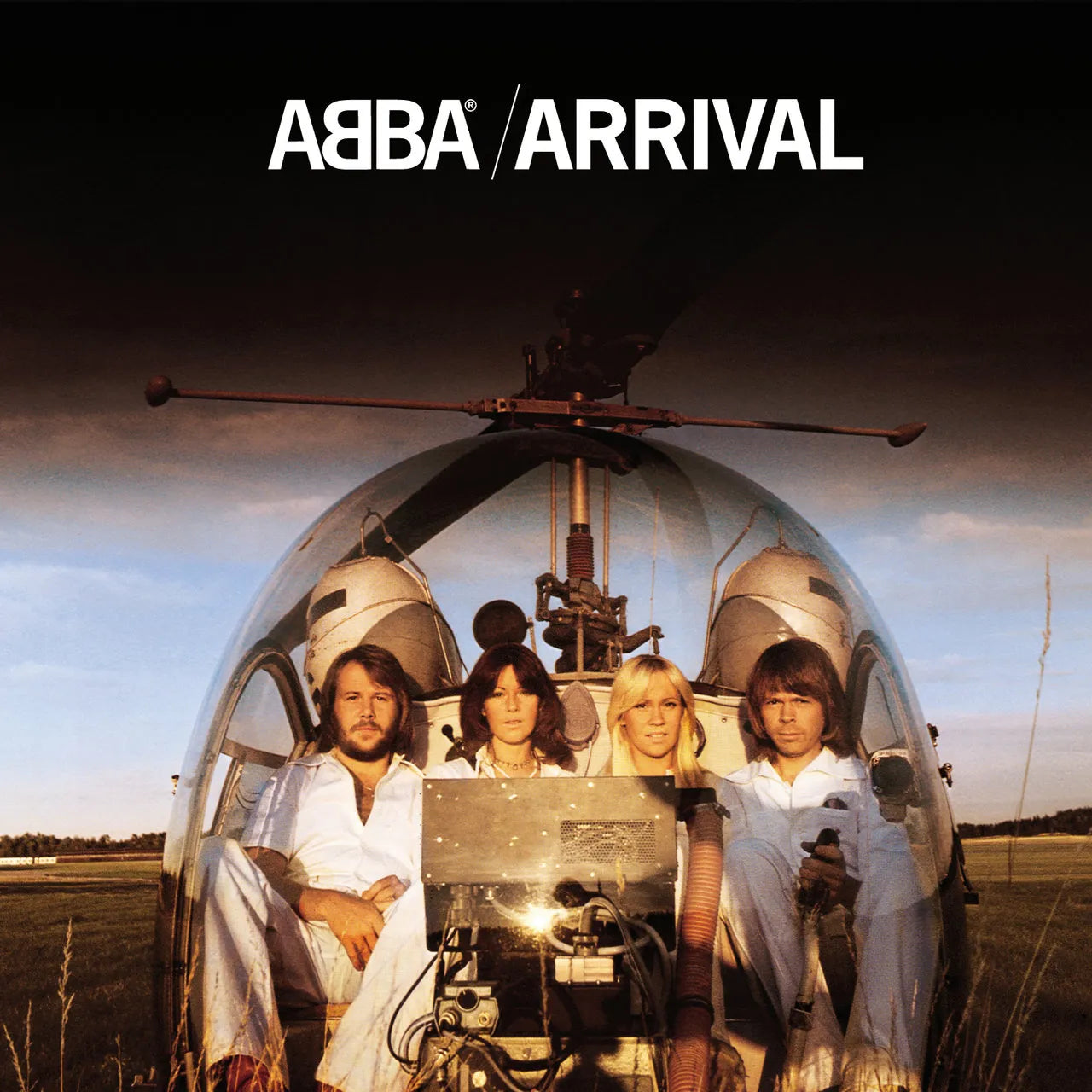 Album cover for Arrival by ABBA showing the band seated inside a white helicopter against a blue sky, wearing coordinated white outfits.