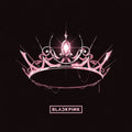 A stylized pink and white tiara with a glowing central gem on a black background, with the text 'BLACKPINK' below it.