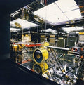 CD album cover for Mirrored by Battles featuring a geometric black-and-white design with abstract shapes, and musical equipment. Reflecting the album’s experimental and rhythmic complexity.