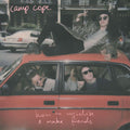 Album cover with people in a car and text 'Camp Cope' and 'how to socialize & make friends'.