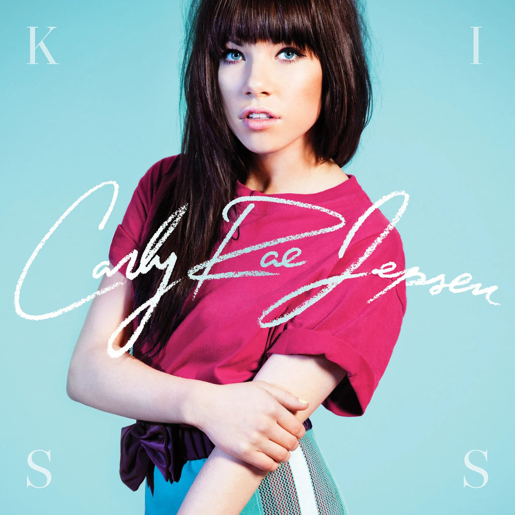 Album cover with a person wearing a red top on a light blue background