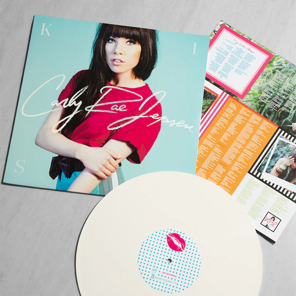 White vinyl album cover for Kiss by Carly Rae Jepsen featuring Carly Rae Jepsen in a playful, colourful pose against a bright background, reflecting upbeat pop aesthetics.