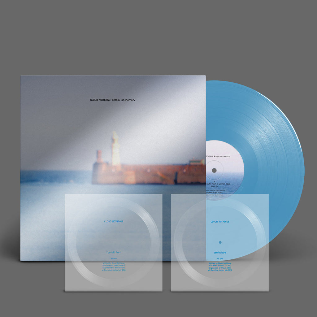 Sky blue vinyl edition of Attack On Memory by Cloud Nothings with clear flexi-discs and stark monochrome artwork reflecting raw indie rock energy.
