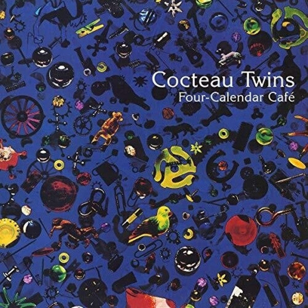 Album cover with colorful objects on a blue background and 'Cocteau Twins' text.