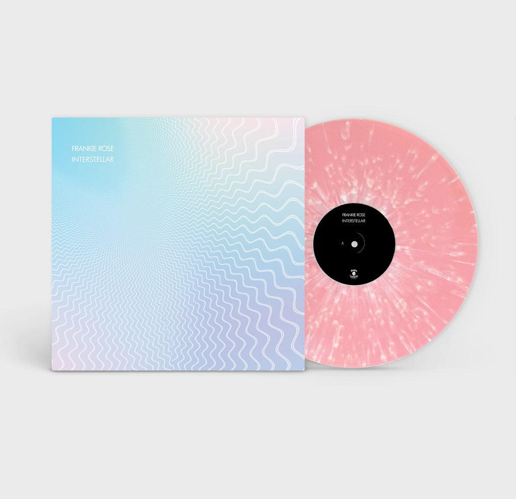 Bubble gum pink with white splatter vinyl edition of Interstellar by Frankie Rose featuring dreamy cosmic artwork in soft pastel tones.