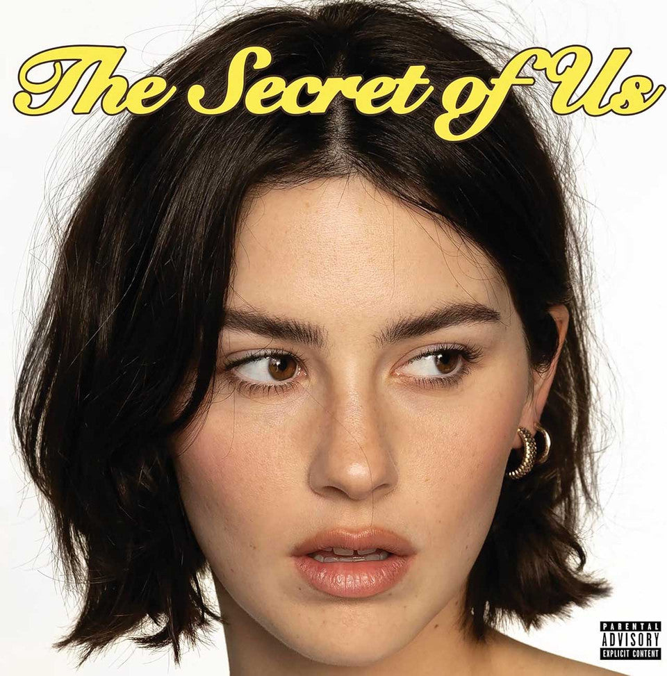 Limited edition yellow vinyl pressing of The Secret of Us by Gracie Abrams featuring the warm, close-up portrait cover art of Gracie smiling.