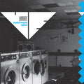 Laundry room with vintage washing machines and a geometric design overlay.