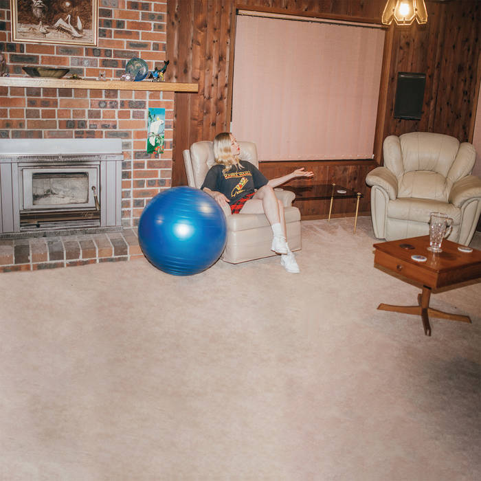Digipak CD edition of Don't Let The Kids Win by Julia Jacklin featuring the vintage style cover photo of Julia in a blue medicine ball.