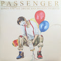 Album cover with a person holding balloons and a bottle, titled 'Songs for the Drunk and Broken Hearted' by Passenger.