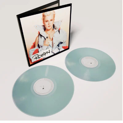 Vinyl records with a cover featuring a person on a white background