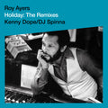 Album cover for Holiday: The Remixes by Roy Ayers featuring a black-and-white photo of Roy Ayers leaning on a mixing desk in a recording studio, with teal background text reading “Roy Ayers Holiday: The Remixes Kenny Dope / DJ Spinna”.