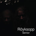 Album cover for Senior by Röyksopp featuring a minimalist black background with abstract white line artwork and understated typography, reflecting the album’s dark, cinematic electronic tone.