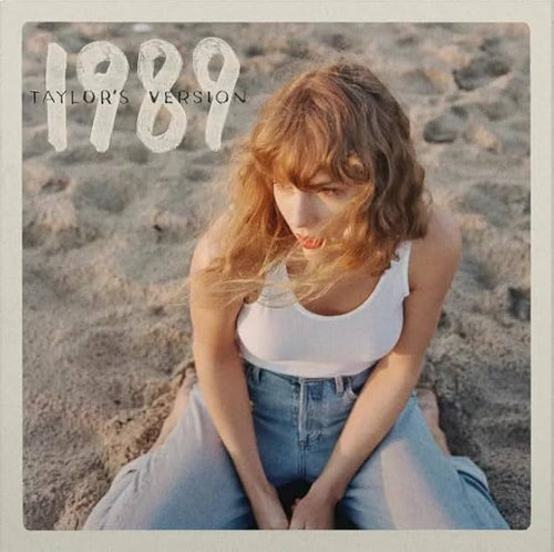 Album cover with a person sitting on the beach, featuring the text '1989 Taylor's Version'.