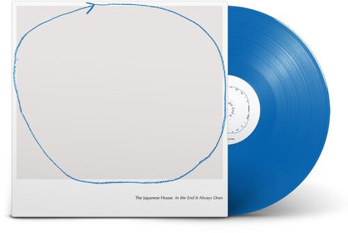Blue vinyl record with white sleeve on a white background